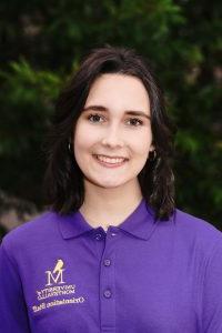 Photo of Meg Mayo in a purple Orientation Leader polo.